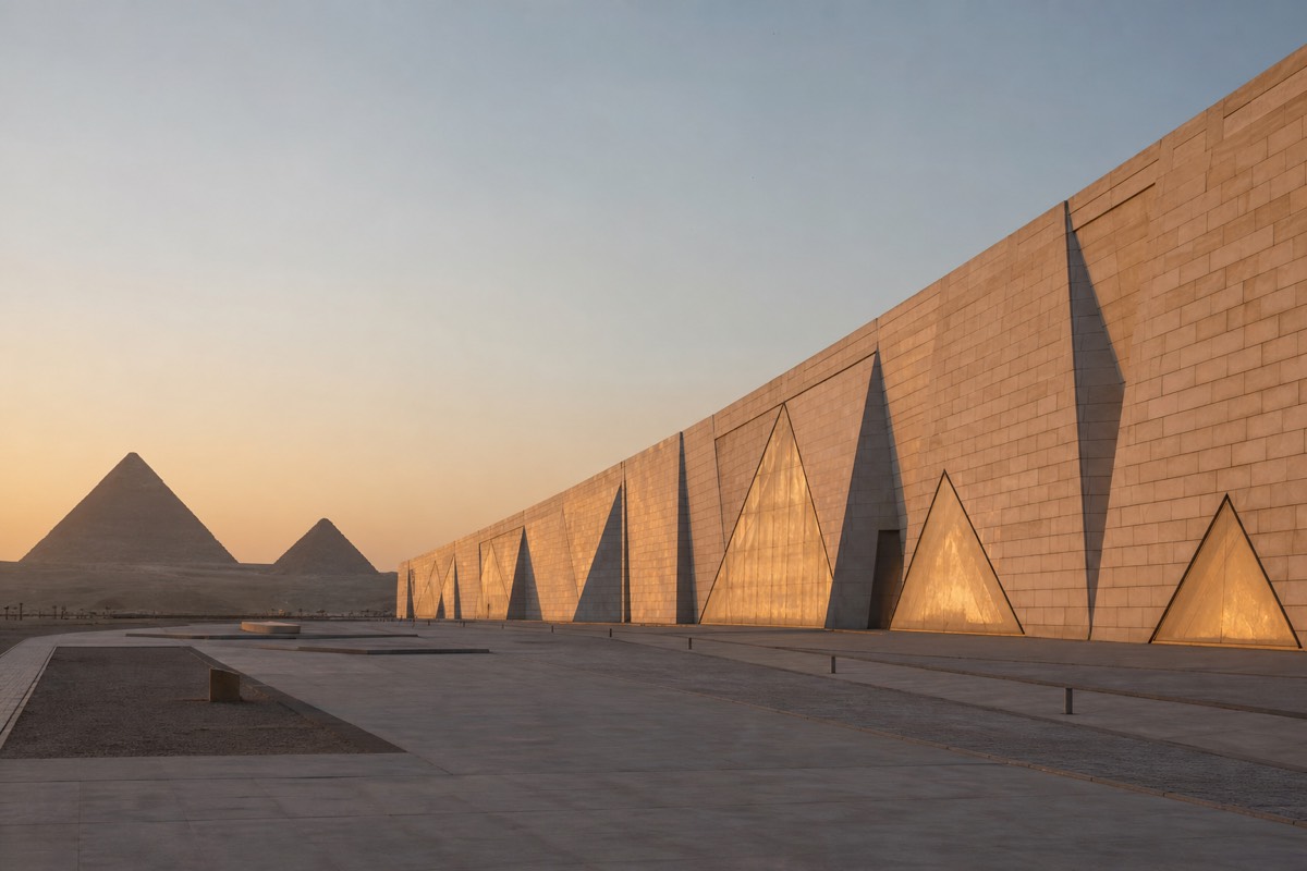 The Grand Egyptian Museum's angular translucent stone facade at dusk